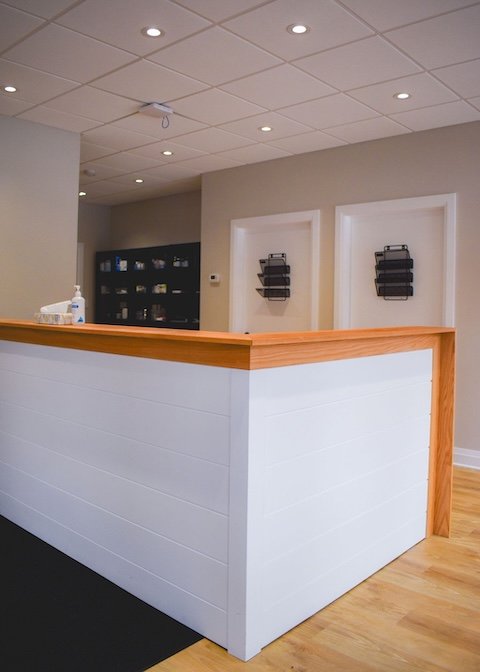 front desk with 2 examination room doors behind it